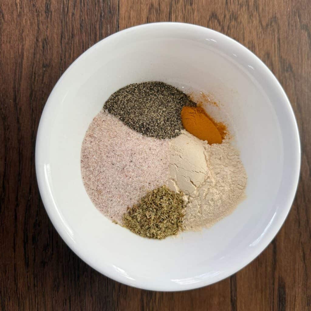 Spices in a bowl for homemade adobo seasoning
