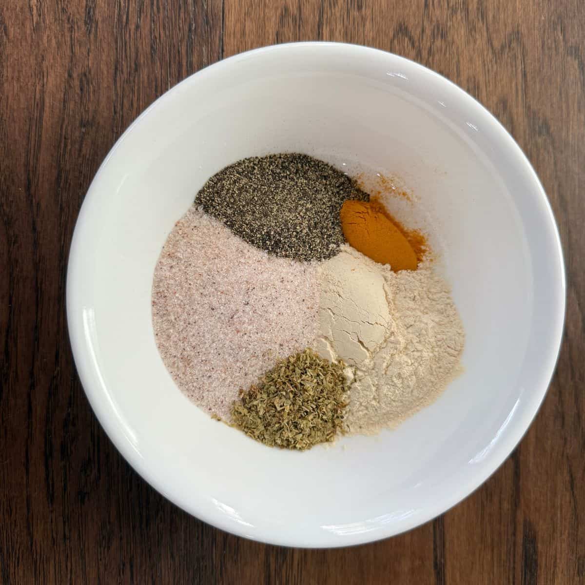 Spices in a bowl for homemade adobo seasoning
